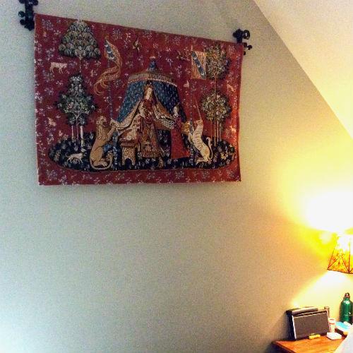 A Mon Seul Desir, no border tapestry hanging in a bedroom A Mon Seul Desir, no border tapestry hanging in a bedroom