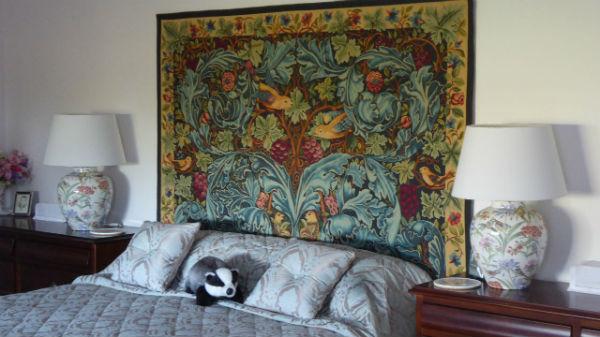 William Morris Acanthus and Vine tapestry in a bedroom
