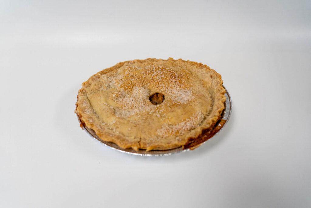Classic Apple Pie with a golden, flaky top crust and tender spiced apple filling, baked to a warm, rustic finish.
