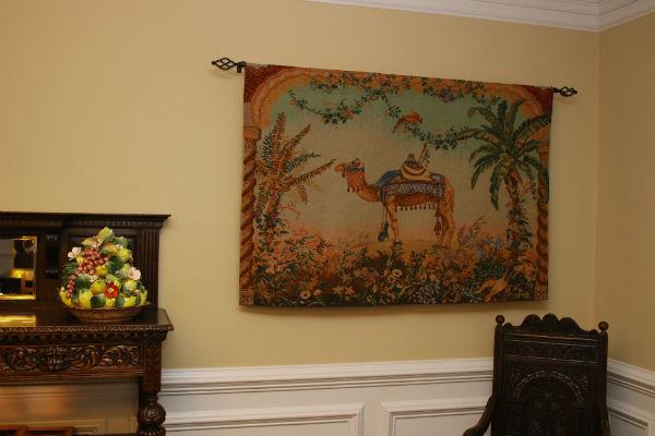 Camel tapestry hanging in a dining room Camel tapestry hanging in a dining room