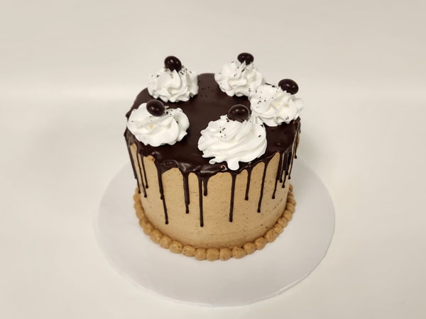 Espresso Chocolate Whipped Cream Torte with rich chocolate layers, espresso-infused whipped cream, and decorative chocolate shavings on top.