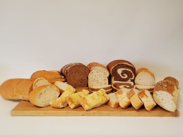 variety of breads on cutting board